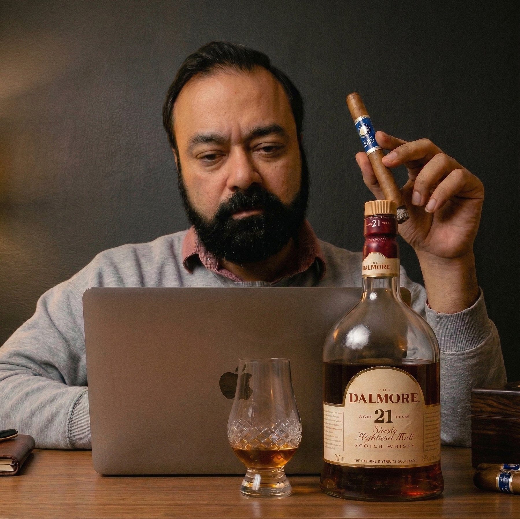 Author at his desk with a cigar and a glass of whisky